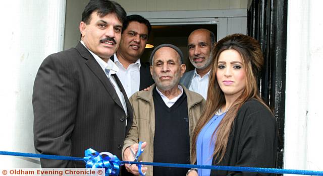 CUTTING the ribbon . . . (front) Sajid Mahmood, Abdul Razzaq and Rosina Mahmood. Back: Councillor Zahid Chauhan and Fida Hussain