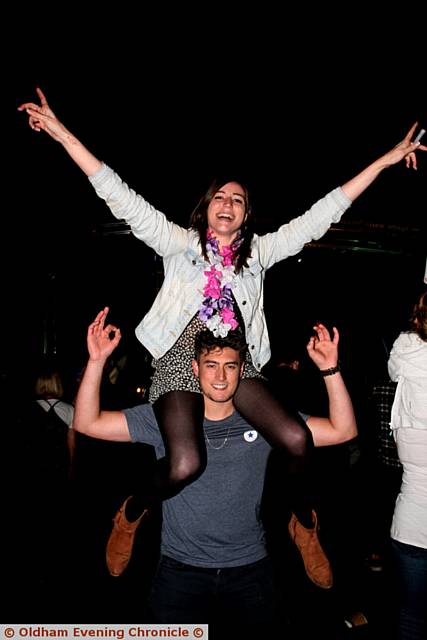 Party in the park, Delph cricket club, Oldham. Pic shows, Melissa Rose on the shoulders of Jake Bennett, enjoying the party. 