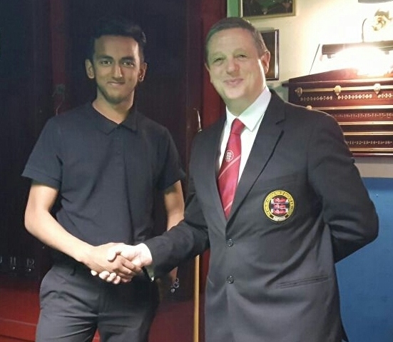 PUT IT THERE . . . North-West Junior Tour winner Saiful Amin with referee Rob Spencer