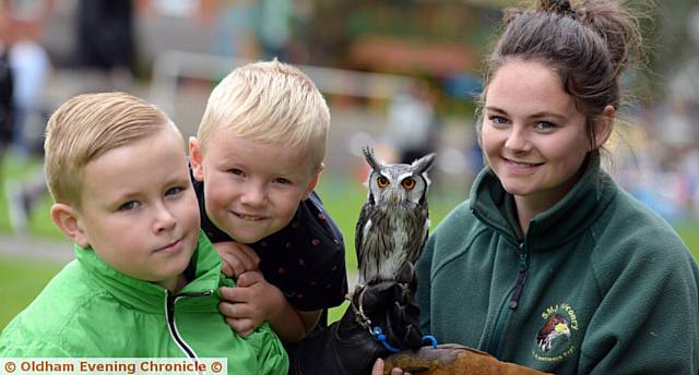 HAVING a hoot . . . Cory Barry (9) and Zac Barry (6) meet Midge the owl and Rhiannon Cowling from SMJ Falconry