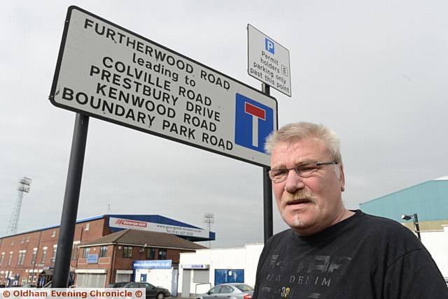 Parking permit holders in Oldham may be charged £15 per year to park outside their houses in future. Pic shows resident Keith Smith in Furtherwood Road, opposite SportsDirect.com Park, home of Oldham Athletic.

