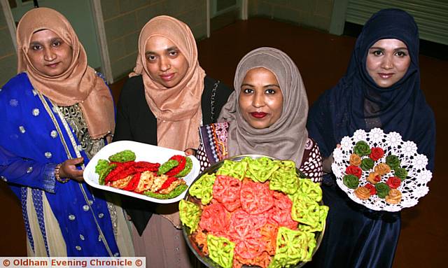 FEAST . . . from the left, Nasima Begum, Parul Begum, Fardusi Rahman, Shah Gharna Begum, with food that was sold at the fundraiser to raise funds for the Al-Khair charity