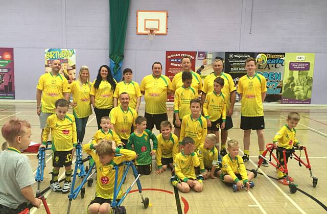 MEMBERS of Chadderton Park cerebral palsy's team of coaches and parents who are taking part in the Tough Mudder challenge, along with some of the players