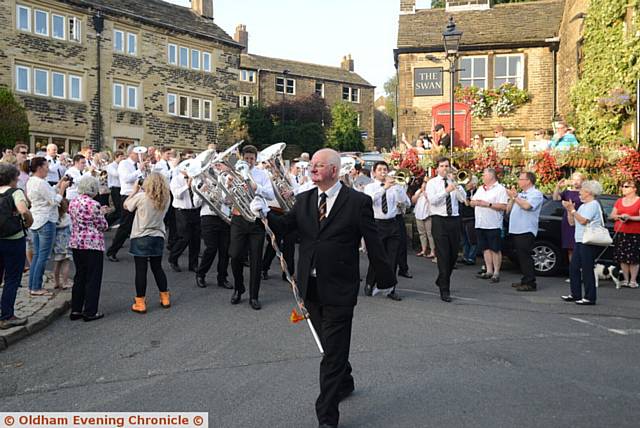 Wellington Brass Band, from New Zealand make a guest appearance at Dobcross Band Club to compensate for missing the Whit Friday Band contest. They are in Britain to take part in the 164th British Open Brass Band Championships in Birmingham at the weekend. Pic shows the band marching through Dobcross.