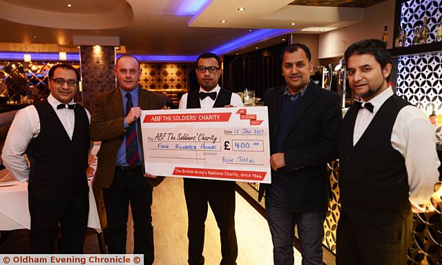 PRESENTATION of £400 to ABF the Soldiers' Charity by the Blue Tiffin Restaurant, raised by the restaurant and its customers. From left, Habibur Rahman, Jim Duffy (ABF the Soldiers' Charity), Terab Ali, Lipon Choudhury (restaurant owner), and Sayful Alam