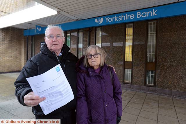 UNHAPPY . . . Mike and Elsie Lawson at the Yorkshire Bank in Chadderton precinct.