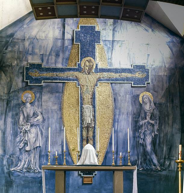 The original mural dating back to 1955 depicts the crucifixion scene with St John and Mary stood either side of Christ.