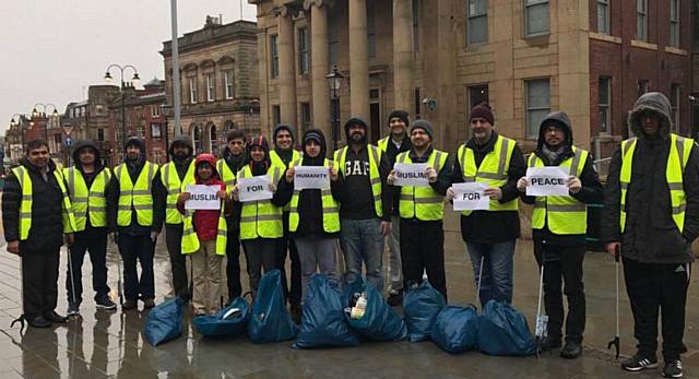 AHMADIYYA Muslims Youth Association members clean up town centre