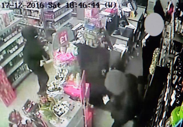 CCTV of the armed robbery in progress