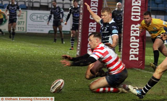 TRY TIME . . . Full-back Scott Turner touches down for Oldham