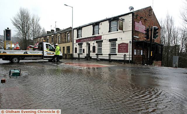 FLOODED . . . Huddersfield Road, outside the Shepherd's Boy pub