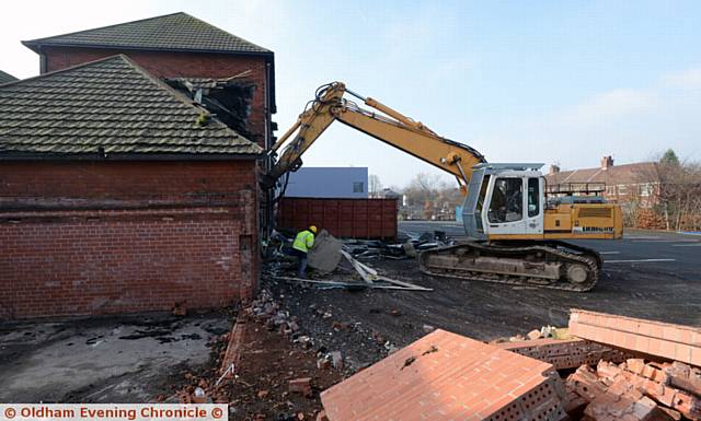 COMING DOWN . . . Demolition work begins at Byron Street School, Royton