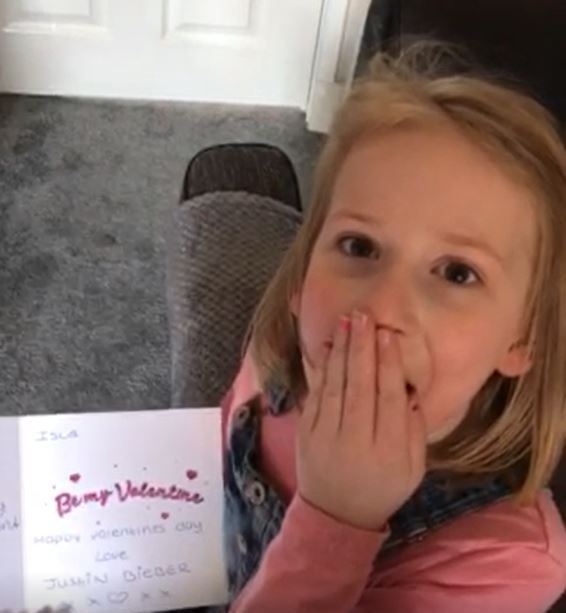SHOCKED . . . Isla with the card