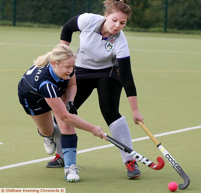 Oldham V Didsbury Greys, hockey match played at Newman College, Oldham. Pic shows, Louise Howard, (blue strip), playing for Oldham, tackling for the ball