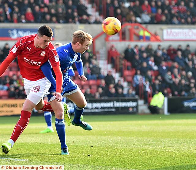 SURVIVAL BELIEF . . . Chris Taylor gets stuck in during last weekend's gritty goalless draw at Swindon