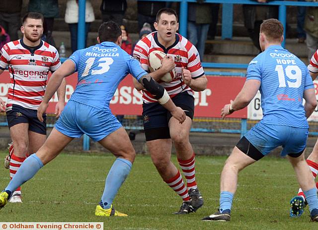 I'M LOOKING AT YOU...Phil Joy, of Oldham, charges towards the Sheffield Eagles line