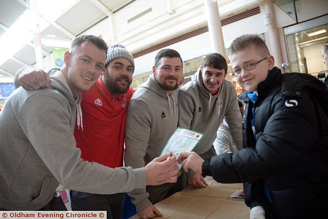 MEET AND GREET...Oldham RL players line up before the fans' signing session at Spindles Town Square