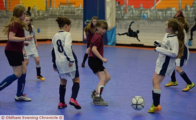 GETTING STUCK IN . . . girls from St Joseph's 'D' team (white shirts) and Mayfield do battle