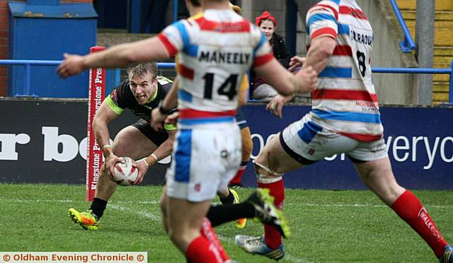 TRY TIME . . . Adam Clay sneaks under the Rochdale defence to score