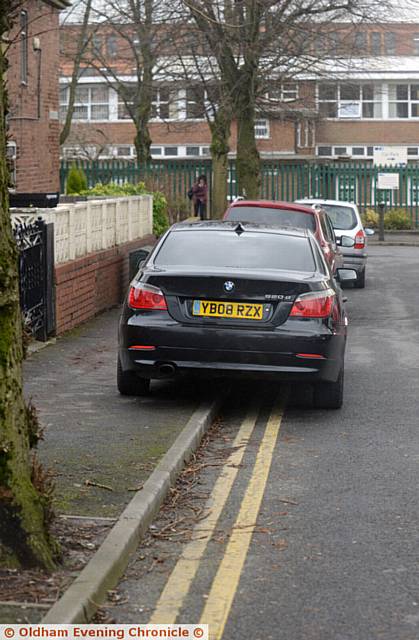 BLOCKED . . . Cars parked on the pavement are causing problems for pedestrians and residents