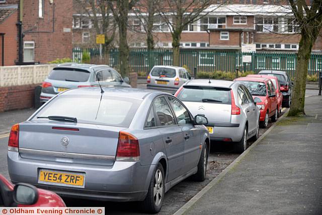 Parking problems on Lynmouth Avenue, Hathershaw as parents wait to pick up their children outside Hathershaw College. Pic shows cars stopping in a 'Residents Only' zone.
