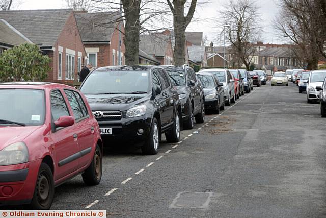 Parking problems on Lynmouth Avenue, Hathershaw as parents wait to pick up their children outside Hathershaw College. Pic shows cars stopping in a 'Residents Only' zone.