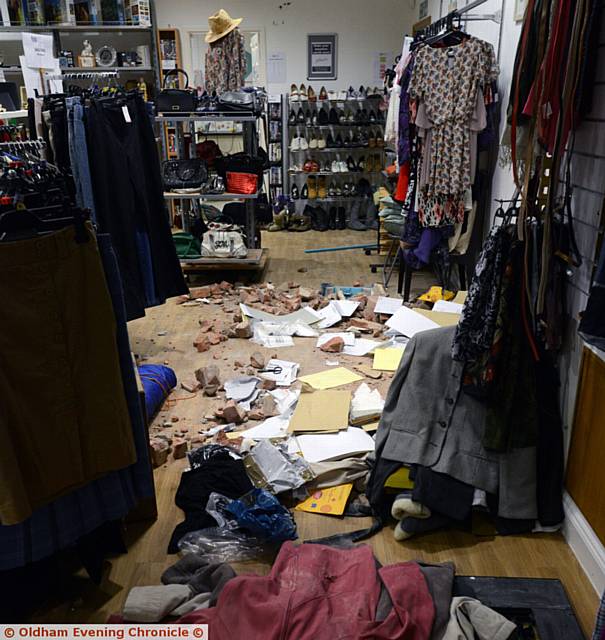 WHAT a mess . . . thieves left clothes strewn across the shop floor