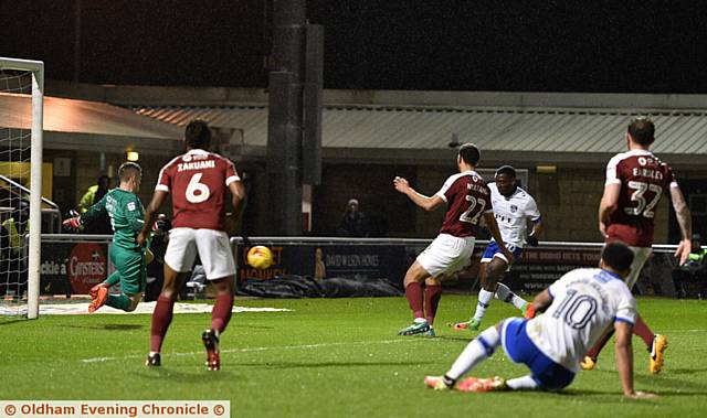STRIKE ONE . . . Tope Obadeyi puts Athletic in front against Northampton Town