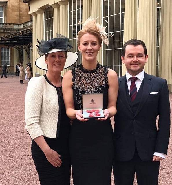SO proud . . . Nicola with mum Gill, boyfriend Edward Harding and her MBE