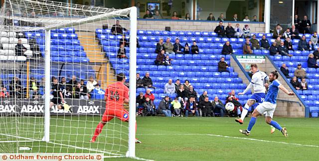 GET IN THERE . . . Lee Erwin scores for Latics in the early stages. 