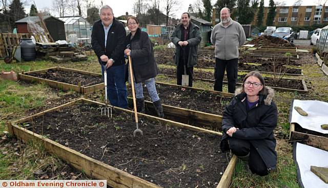 Residents at Cartmel Crescent allotments in Chadderton. People are being encouraged to experience the joys of growing their own produce as allotment waiting lists shrink and plots across Oldham remain vacant. PIC L-R: Tony Roberts, Dawn Repton, Nick Perrin, Andy Mullington and Diane Drinkwater.