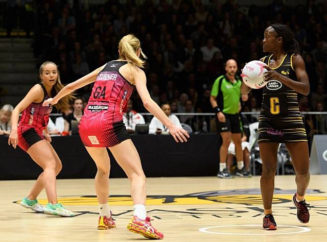 THUNDER'S Kathryn Turner (centre) looks to take the sting out of a Wasps player