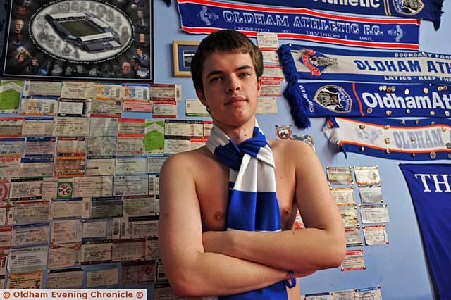 BY GEORGE . . . Parkin, who is known for taking his top off at matches, pictured in his bedroom with Latics memorabilia
