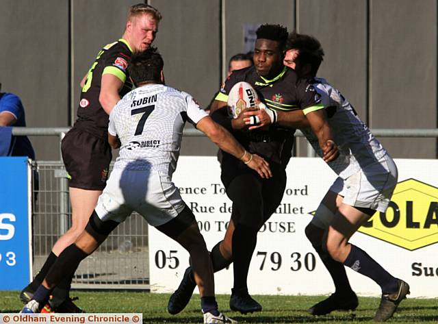 RUNNING INTO TROUBLE . . . the gap closes on Oldham's Tuoyo Egodo