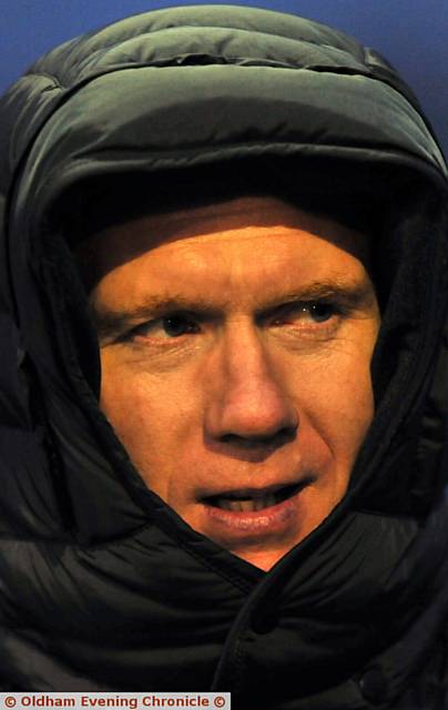 WRAPPED UP . . . Paul Scholes looks on.