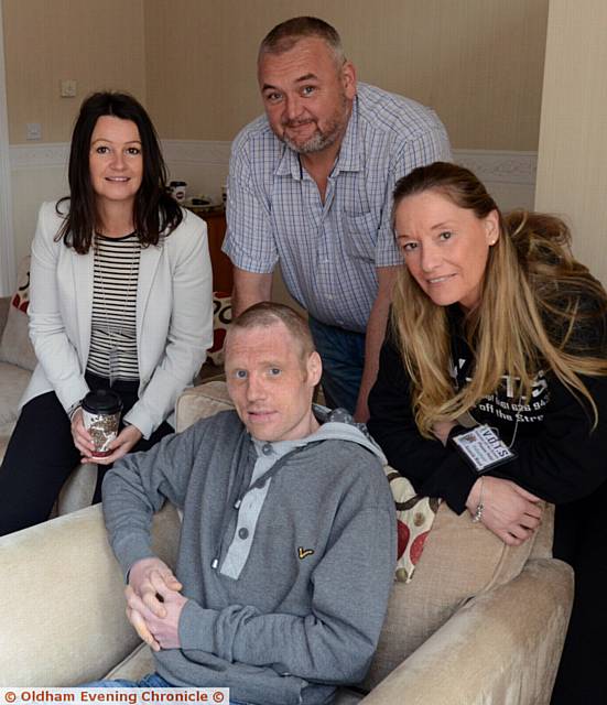 OFF the streets . . . Phil in his new home with (from left) Debbie White, Gary Curley and Amanda Wood