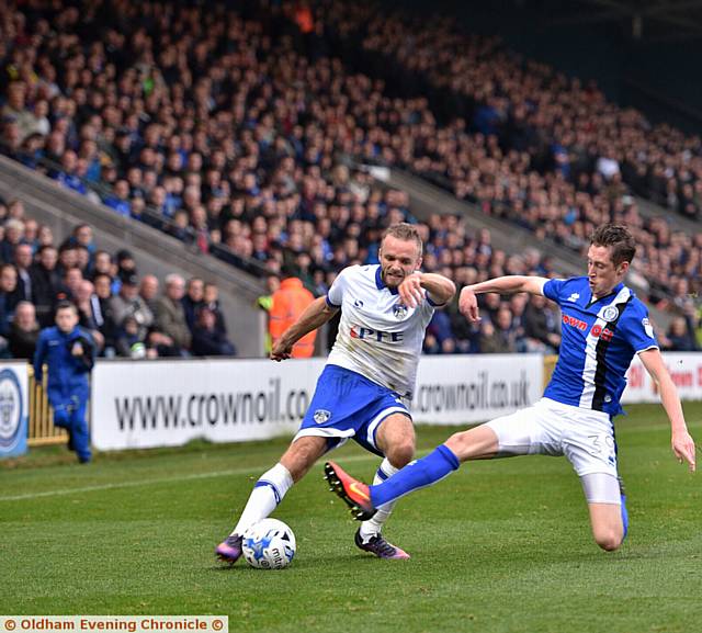 DERBY DUEL: Rochdale's Joe Bunney tackles Athletic's Ryan McLaughlin the last time the two sides met