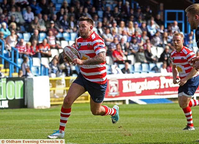 MAN ON THE RUN . . . Oldham forward Ben Davies goes on the charge at Featherstone