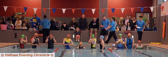 SWIMMERS take to the water at Saddleworth Pool 