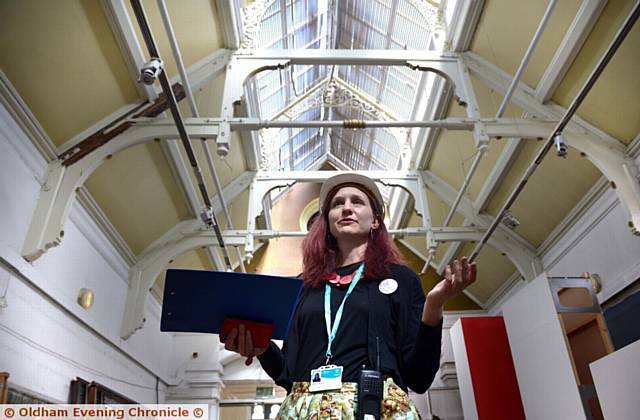 TOUR . . . Art curator Rebecca Hill leads the Transformation Tour of the old Oldham Gallery
