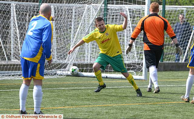 GET IN . . . Town's Wayne Dean scores an early goal
