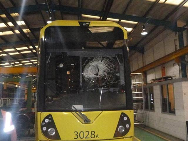 HORROR . . . The smashed windscreen of the tram after rock thrown at it from a footbridge north of the Derker Metrolink stop, causing injuries to the driver's face and chest

