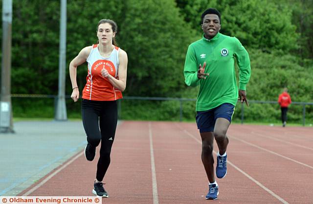 RIGHT ON TRACK . . . Sophie Hall and Reality Osouha, both 16, who struck gold for Oldham and Royton Harriers. PICTURE by ANTHONY MILLER