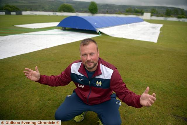 COVERED UP: Crompton captain Simon Wright is pictured in front of the wet square at Glebe Street
