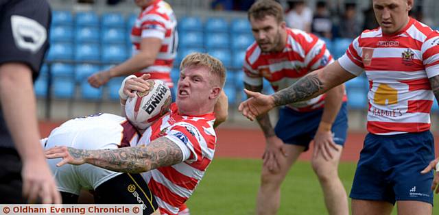 TAKEN DOWN: Roughyeds star George Tyson heads towards the turf after being tackled