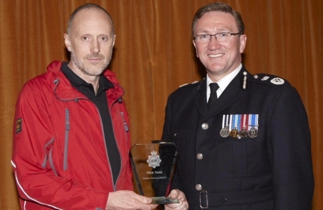 WELL done . . . Mick Nield is presented with a Chief Constable's Commendation by Ian Hopkins