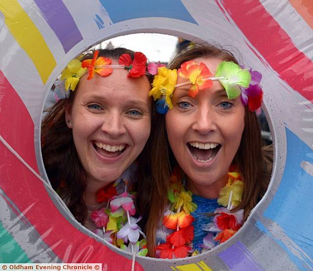 ALL SMILES . . . Victoria Robinson (left) and Joanne Ogden from Higher Failsworth School on their summer float 
