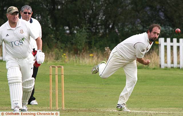 NICE AND TIDY . . . Austerlands bowler and skipper Andy Young in action during the welcome win against Saddleworth