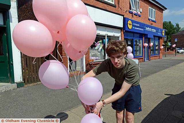 Pink balloons placed outside shops in Ashton Road East, Failsworth to mark the Manchester Arena attack. Pic shows Lewis Garrity (21) from the Little Gift Shop.
