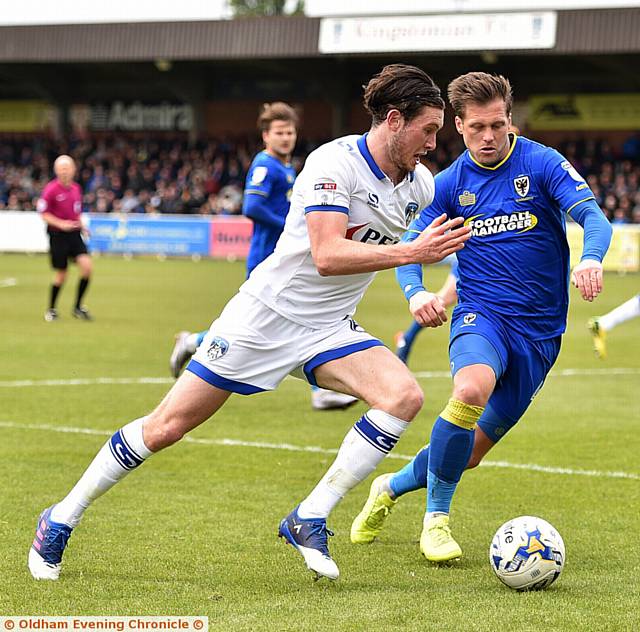 AIDAN O'Neill goes on the outside of the AFC Wimbledon defence